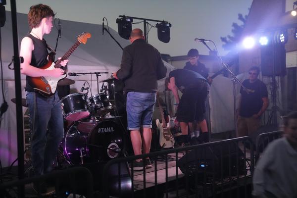 McApple live on stage at dusk